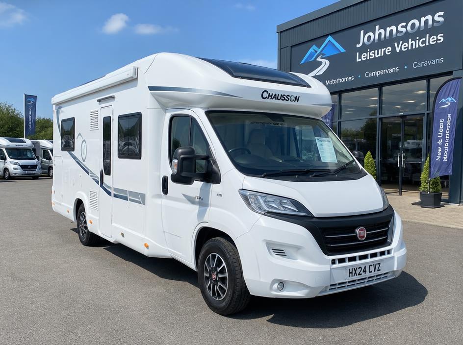 Motorhome outside a leisure vehicle dealership